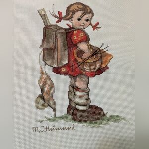 Pair of hand stitched Hummel boy and girl schoolchildren.